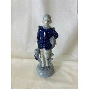 Vintage Porcelain Figurine Of Boy In Blue Coat Holding Hat & Scroll